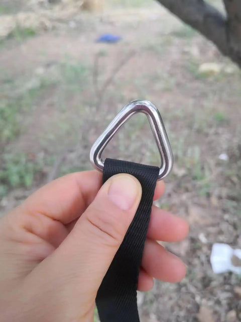 Person holding Beefy Stainless Steel 316 Marine Grade Triangle Ring Buckle Welded V Shaped Heavy Duty Ring with black strap attached