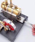 Hands adjusting Hands On Steam Engine Model Kit With Boiler For DIY Projects, Metal Beam Engine Build For Tinkerers