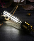 Dimmable T10 LED Filament Tubular Bulb 4000K Daylight White, 6W Edison Style, E26 Base glowing in a dark setting