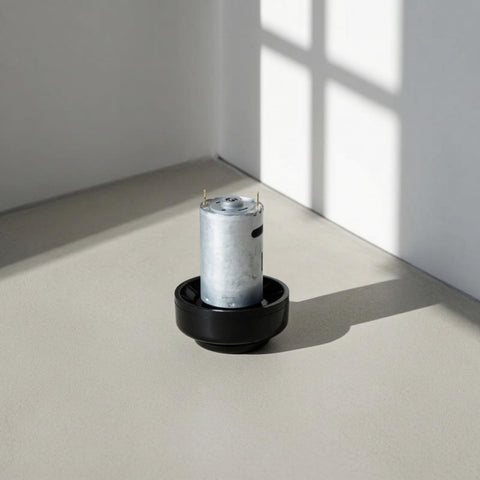 Heavy Duty Micro DC 390 High Speed Electric Motor For Vacuum Cleaner Upgrade, compact metal motor with black base positioned on floor.