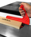 Hand using a red V-type push stick on a table saw with wood, part of the 4Pcs Safety Push Sticks for Woodworking set.