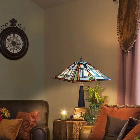 Stained Glass Tiffany Table Lamp 16 Inch Wide With Dope Mission Frank Lloyd Wright Style on a living room table at night