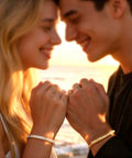 Couple holding hands wearing bracelets, showcasing the DIY Permanent Bracelet Kit With Ring Shaped Clasp For Couples And Friends.