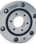 Premium Class P5 Crossed Roller Bearing For Rotary Tables showing a silver round bearing with central hole and mounting holes.