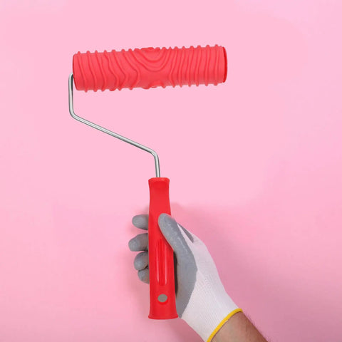Premium Textured Rubber Paint Roller For Wall Decor And DIY Room Makeovers Featuring A Crystal Clear Embossed Design held in hand.