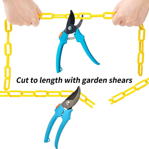 Person using garden shears to cut 200 ft Yellow Plastic Chain Barrier For Crowd Control And Event Decor, Heavy Duty Weatherproof UV Resistant Safety Links