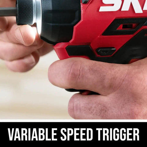 Close-up of hand using Rock Solid Brushless 20 Volt Compact Impact Driver Kit featuring variable speed trigger for precision control.