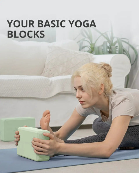 Premium Soft Foam Yoga Blocks For Pilates And Meditation Lightweight Odorless Cushioned Supports For Stretching Toning and Daily Fitness Killer Comfort Mint Green Two Pack shown during a yoga stretch.