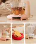 Smart Coffee Mug Warmer With Digital Display And Three Heat Settings Touch Switch Electric Cup Heating Pad To Keep Your Daily Brew Nice And Toasty Ultimate Winter Gift Beige with a glass mug on a pink heating pad.