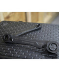 2 Piece X6 4 In 1 Black Oxide Spline Ratcheting SAE Wrench Set With 5 Degree Arc And X6 Beast Box Ends on textured surface