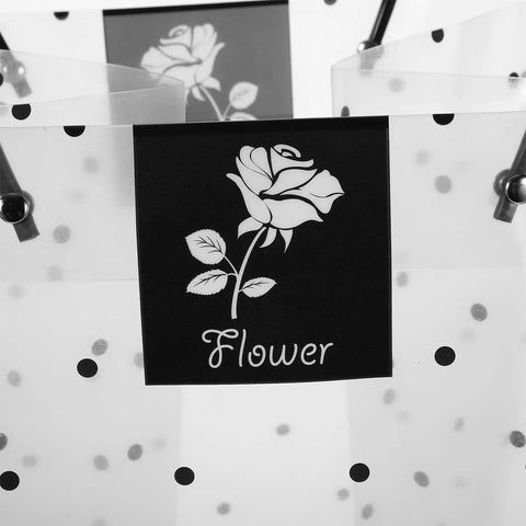 Clear plastic flower packaging bags with handle for bouquets, showing rose design, easy to carry floral wrapping for weddings.