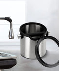 Pro Made Stainless Steel Coffee Knock Box And Espresso Tamping Station with shock dampening grip and easy lift tray on kitchen countertop.