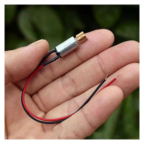 3V Mini Vibration Motor Ultra Compact 8mm By 14.5mm With Copper Eccentric Vibrator held in hand for size reference