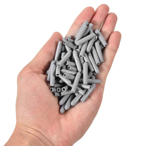 Hand holding 150 Pcs Dishwasher Rack Prong Repair Caps Anti Slip End Tips For Tines, Durable PVC Protectors, Gray Finish