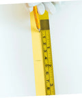 No Sweat Self Adhesive Measuring Ruler Tape 2 Pack for Industrial Workbenches, being marked with a pencil on a flat surface.