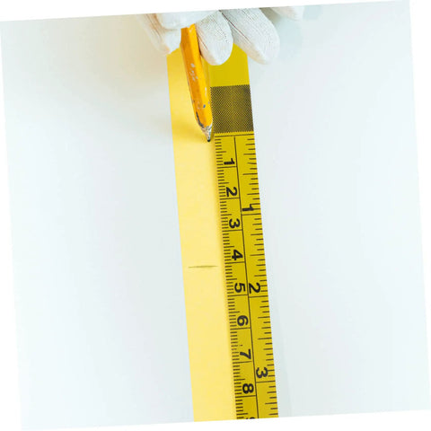 No Sweat Self Adhesive Measuring Ruler Tape 2 Pack for Industrial Workbenches, being marked with a pencil on a flat surface.