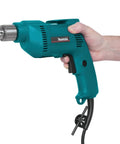 Person holding Three Eighths Inch Drill With 4.9 Amp Motor, Variable Speed 0 to 2500 RPM, In Line Handle, Reversing Switch