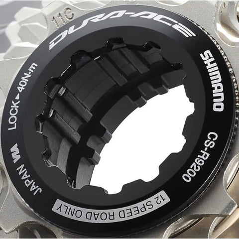 Close-up of Dura Ace 12 Speed Cassette Sprocket CS R9200 For Road Bikes showing lock ring details and part of the cogs.