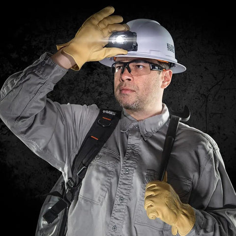 Worker with gloves adjusts Intrinsically Safe LED IP67 Headlamp for Hazardous Areas Attaches to Hard Hats and Safety Helmets