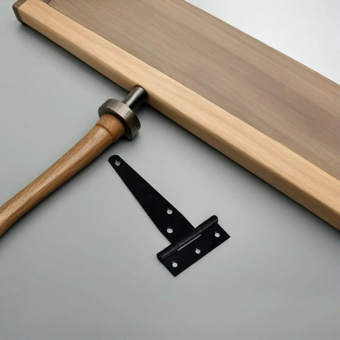 8 Pack Black T Shape Gate Hinges With Screws Zinc Plated T Strap Hinges next to wooden handle and board