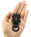 Hand holding a Beefy Heavy Duty Aluminum Alloy Carabiner With 360 Degree Rotation Quick Release Frog Buckle Clip For Camping And Hiking
