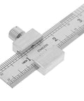 Stainless Steel Ruler With Clip Stopper showing metric and inch scales, precision machinist straight edge visible in close-up.