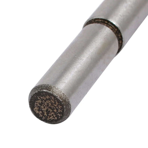 End view of Aexit 21mm hinge-boring drill bit; steel alloy shaft with textured end.