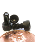 Tough As Nails Number 4 40 By Quarter Inch Socket Head Cap Screws featuring thermal black oxide coating, displayed with a penny.