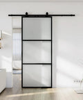 30 X 84 Inch Metal And Glass Sliding Barn Door With Installation Hardware Kit And Soft Close - Rust-Resistant Powder Coated Exterior, Clear Or Frosted Tempered Glass, Disassembled In Three Parts For Easy Shipping And Quick Setup installed in a modern living room setting.