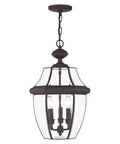 Monterey 3 Light Outdoor Hanging Lantern In Bronze Finish Solid Brass Construction Clear Beveled Glass Traditional Outdoor Lighting Fixture For Porch Patio Or Entryway, showcasing three bulbs inside clear glass with bronze detailing