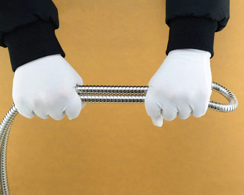 Hands gripping 100 Inch Universal Handheld Shower Hose With Stainless Steel And Polished Chrome Finish, Flexible Anti Kink Tubing