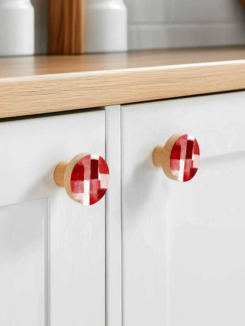 Premium 2 Piece Christmas Cabinet Knobs And Drawer Pulls Featuring A 1.4 Inch Round Design With A Killer Red Abstract Gradient Finish Crafted From Smooth Solid Beech Wood For Sweet Home Renovations on white kitchen cabinet.
