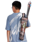 Person wearing a Camouflage Arrow Quiver Backpack For Adults, Large Capacity Hip Quiver Holder with arrows, outdoor use.