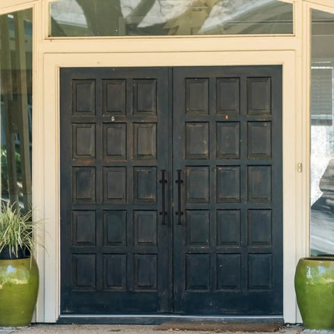 Dark wooden double doors with Heavy Duty Cast Iron Gate Handle 11.81 Inch Barn Door Pull With Vintage Rustic Farmhouse Charm