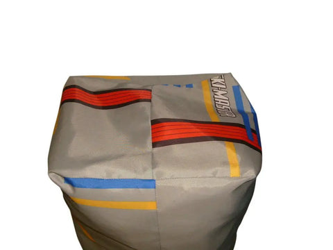 Top view of Beefy 50 Inch Giant Stuff Sack For Ski Gear And Sleeping Bags, Water Resistant Nylon Drawstring Bag With Carry Strap, Great Laundry Or Equipment Tote, Stows Two Single Sleeping Bags, Made In USA, in silver nylon with colorful stripes.