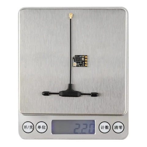 2.4GHz ELRS RP1 FPV Receiver Nano With 65mm UFL T Antenna on digital scale showing weight