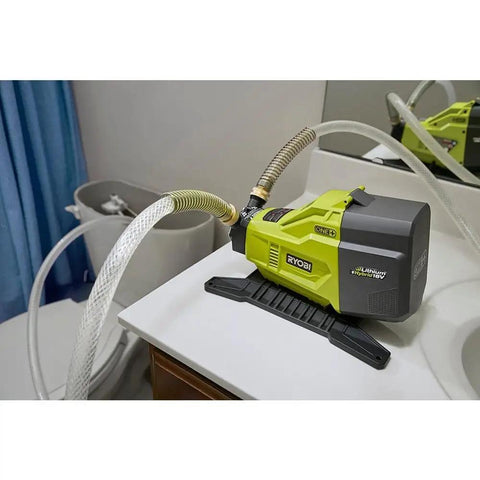 Portable Water Transfer Pump With Hybrid Power, 18V Battery Or 120V AC, Free Standing Base For Easy Standalone Operation shown on tabletop