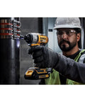 Worker using 20V Max Cordless Impact Driver Kit with Brushless Motor One Quarter Inch Hex Chuck Two Batteries and Charger