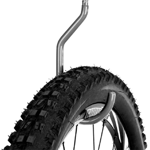 Close-up of a bike tire hung on a 8 Pack Bike Hanger Storage Hooks Heavy Duty Steel Screw In Hooks For Garage Wall And Ceiling Bicycle Storage Utility Tool Hanger Easy Install In Stud Walls Gray.