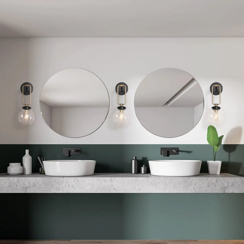 Bathroom with Dope Farmhouse Globe Wall Sconce With Black And Gold Finish 1 Light Wall Light Clear Glass Shade beside mirrors.