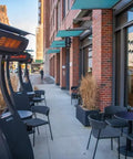 Freestanding 11000W Gas Patio Heater For Outdoor Warmth With Instant Infrared Heat On Demand installed outside a cafe