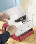 Heavy Hitter 7 Inch Wet Tile Saw With Rust Proof Stainless Top And Adjustable Rip Fence cutting ceramic tile set on flat surface.