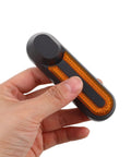 Hand holding electric scooter side cover replacement with reflective strips and screws aluminum alloy side panel universal fit accessory