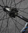 15mm To 12mm Front Thru Axle Fork Adapter For Bikes in aluminum alloy on a wheel hub, anodized finish, easy install, converts 15mm hubs to 12mm forks.