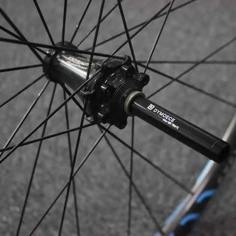 15mm To 12mm Front Thru Axle Fork Adapter For Bikes in aluminum alloy on a wheel hub, anodized finish, easy install, converts 15mm hubs to 12mm forks.