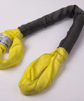 Pro Grade Heavy Duty Eye To Eye Polyester Round Lifting Sling In Bright Yellow Two And Half Inches By 12 Feet Long with Cordura shield.