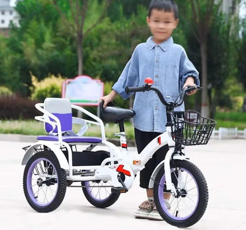 Child standing with outdoor kids pedal tricycle for ages 3 to 10, three wheel trike with chain drive, tandem purple rear seat.