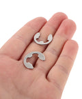 Assorted Stainless Steel External Retaining Ring Kit With 10 Sizes In A Sturdy Plastic Box Easy Removal And Grab And Go Transport Ideal For Assembly Maintenance And Professional Projects, two rings in hand