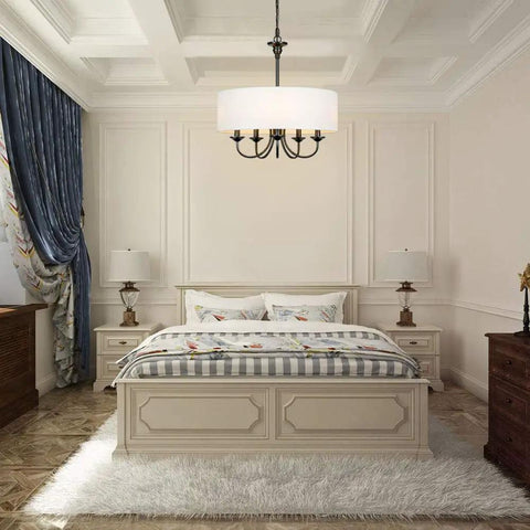 Five Light Traditional Chandelier With White Linen Drum Shade in bedroom setting, oil rubbed black finish, adjustable height