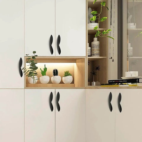 Modern kitchen with cabinets featuring 4Pcs Arcuate Cabinet Pulls 3.8 Inch Center To Center S Shaped Matte Black Zinc Alloy Drawer Pulls.